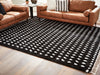 Minston - 5' x 7' Rug - Black / White Signature Design by Ashley®