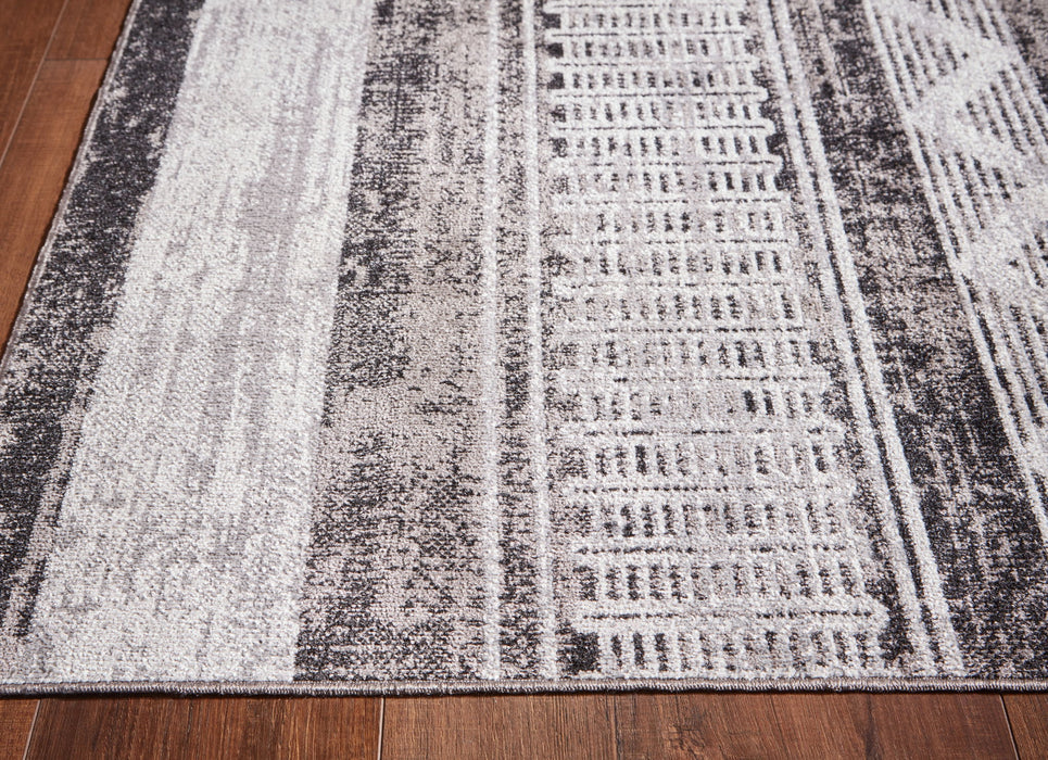 Henchester - 5' x 7' Rug - Multi Signature Design by Ashley®