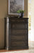 Wickenger - Five Drawer Chest - Dark Brown Signature Design by Ashley®