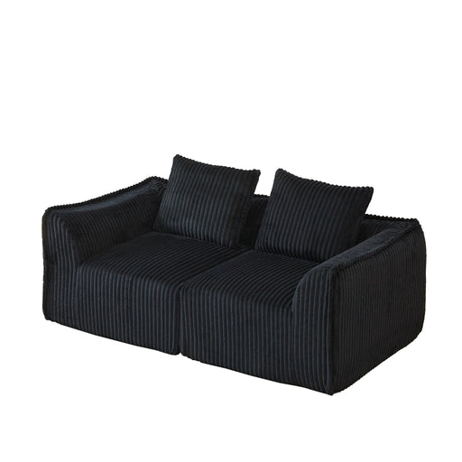 Minimalist Sofa With Curved Lines And Horn Shaped Throw Pillows Home Essentials