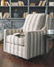 Kambria - Swivel Glider Accent Chair - Ivory / Black Signature Design by Ashley®