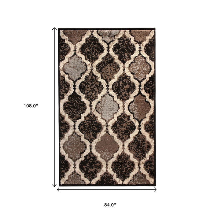 7' x 9' Quatrefoil Power Loom Distressed Stain Resistant Area Rug - Chocolate