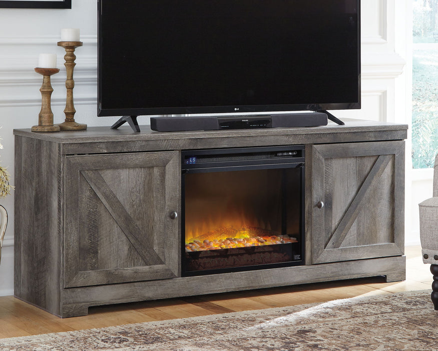 Wynnlow - 63" TV Stand With Glass/Stone Fireplace Insert - Gray Signature Design by Ashley®
