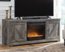 Wynnlow - 63" TV Stand With Glass/Stone Fireplace Insert - Gray Signature Design by Ashley®