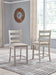 Skempton - Upholstered Barstool (Set of 2) - White Signature Design by Ashley®