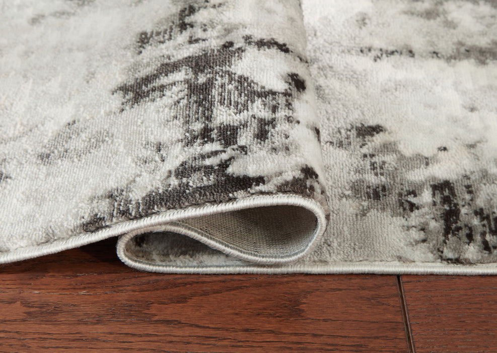 Greyland - 5' x 7' Rug - Multi Signature Design by Ashley®