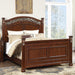 Bed With Ornate Carvings And Curved Headboard Home Essentials