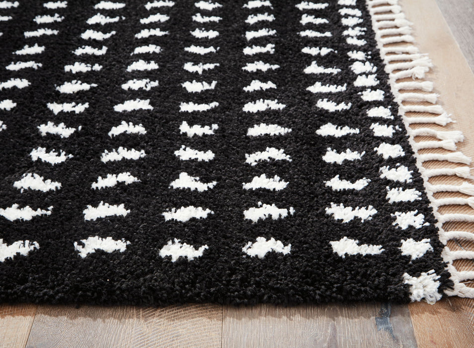 Minston - 5' x 7' Rug - Black / White Signature Design by Ashley®