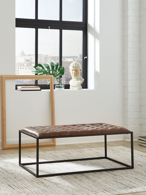 Junsor - Cocktail Ottoman - Brown / Black Signature Design by Ashley®