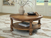 Chadworth - Round Cocktail Table - Medium Brown Signature Design by Ashley®