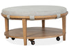 Lindon - Round Cocktail Table With Gray Upholstered Top & Casters - Belgian Wheat Magnussen Furniture