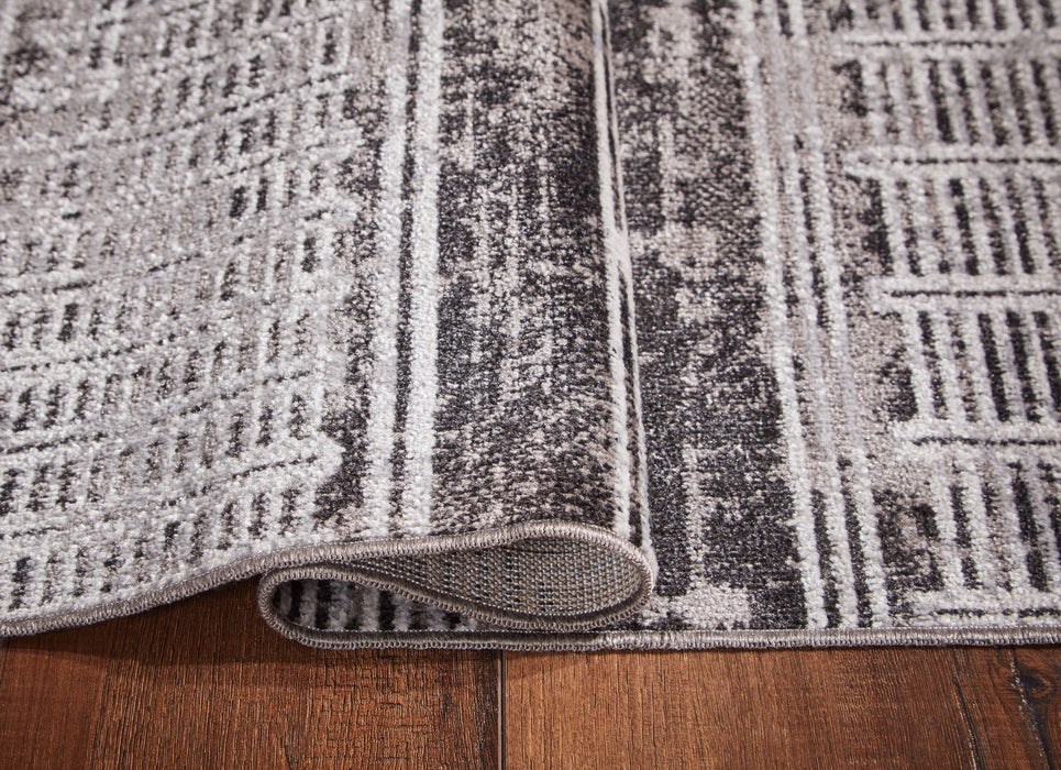 Henchester - 5' x 7' Rug - Multi Signature Design by Ashley®