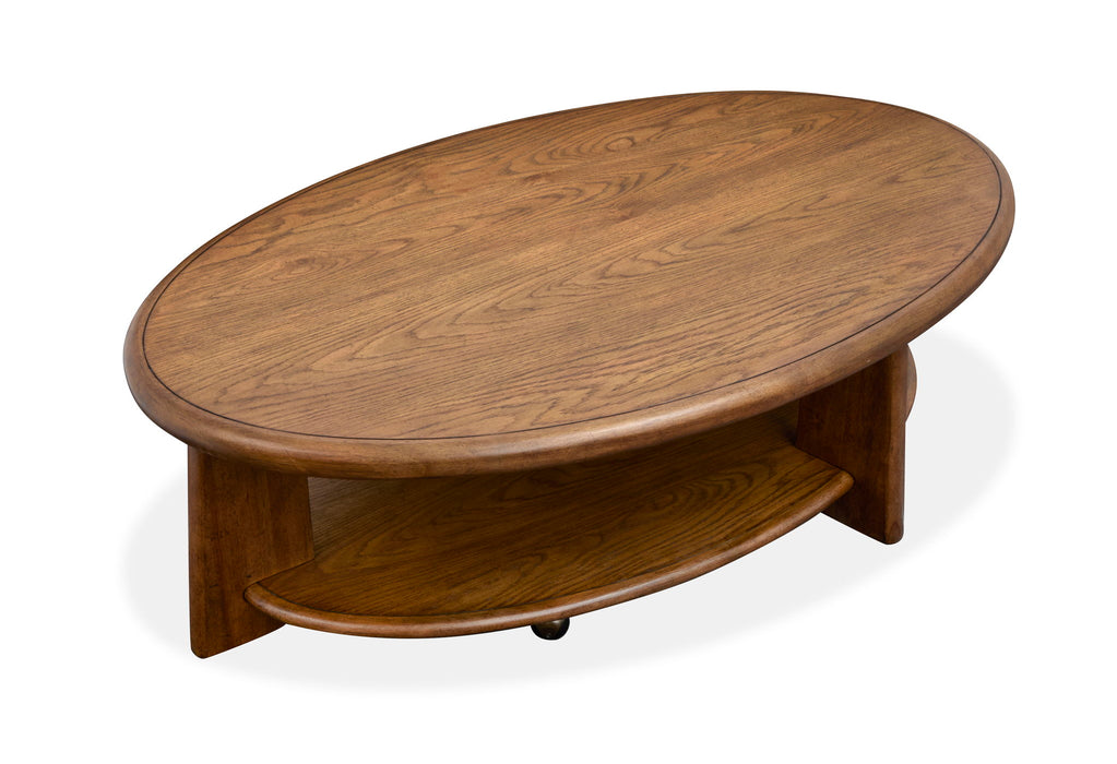 Tanner - Oval Cocktail Table With Casters - Tawny Brown Magnussen Furniture