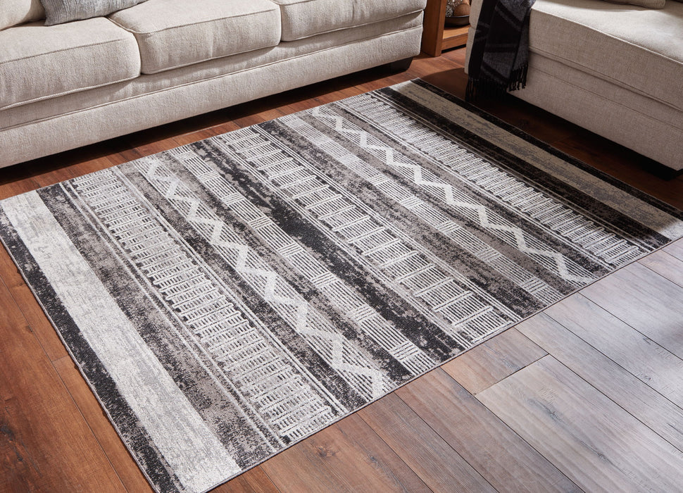 Henchester - 5' x 7' Rug - Multi Signature Design by Ashley®