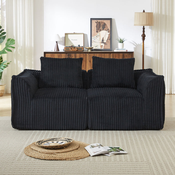 Minimalist Sofa With Curved Lines And Horn Shaped Throw Pillows Home Essentials