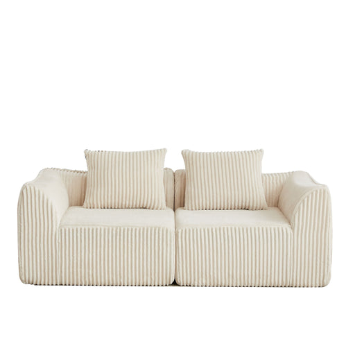 Minimalist Sofa With Curved Lines And Horn Shaped Throw Pillows Home Essentials