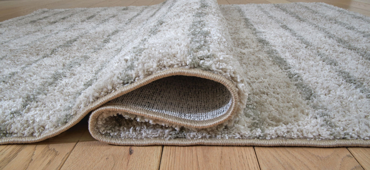 Laddway - 5' x 7' Rug - Cream / Green Signature Design by Ashley®