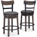Caitbrook - UPH Swivel Barstool  - Gray Signature Design by Ashley®