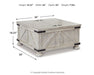 Carynhurst - Cocktail Table with Storage - Whitewash Signature Design by Ashley®