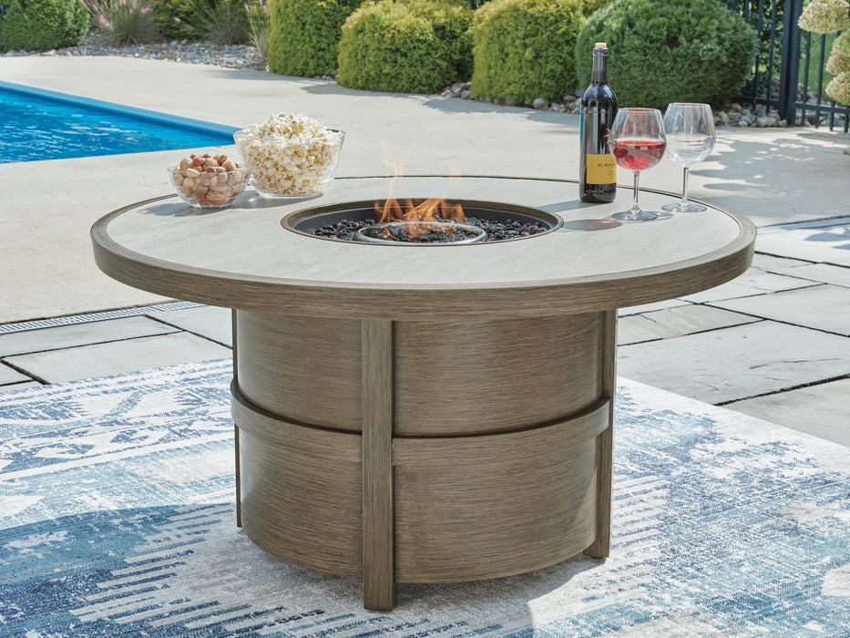 Rainier Ranch - Round Fire Pit Table - Beige Signature Design by Ashley®