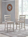 Skempton - Upholstered Barstool (Set of 2) - White Signature Design by Ashley®