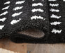 Minston - 5' x 7' Rug - Black / White Signature Design by Ashley®