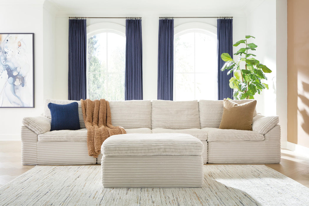 Fannin - 4-Piece Sectional With Ottoman - Ivory Signature Design by Ashley®