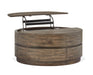 Baisden - Round Lift Top Cocktail Table With Casters - Tobacco Magnussen Furniture